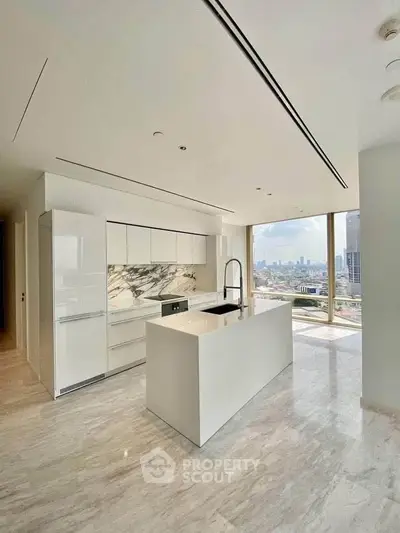 Luxurious modern kitchen with marble accents and stunning city view
