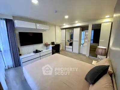 Spacious modern bedroom with elegant decor and ample storage space