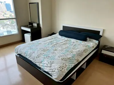 Spacious bedroom with city view and modern furnishings