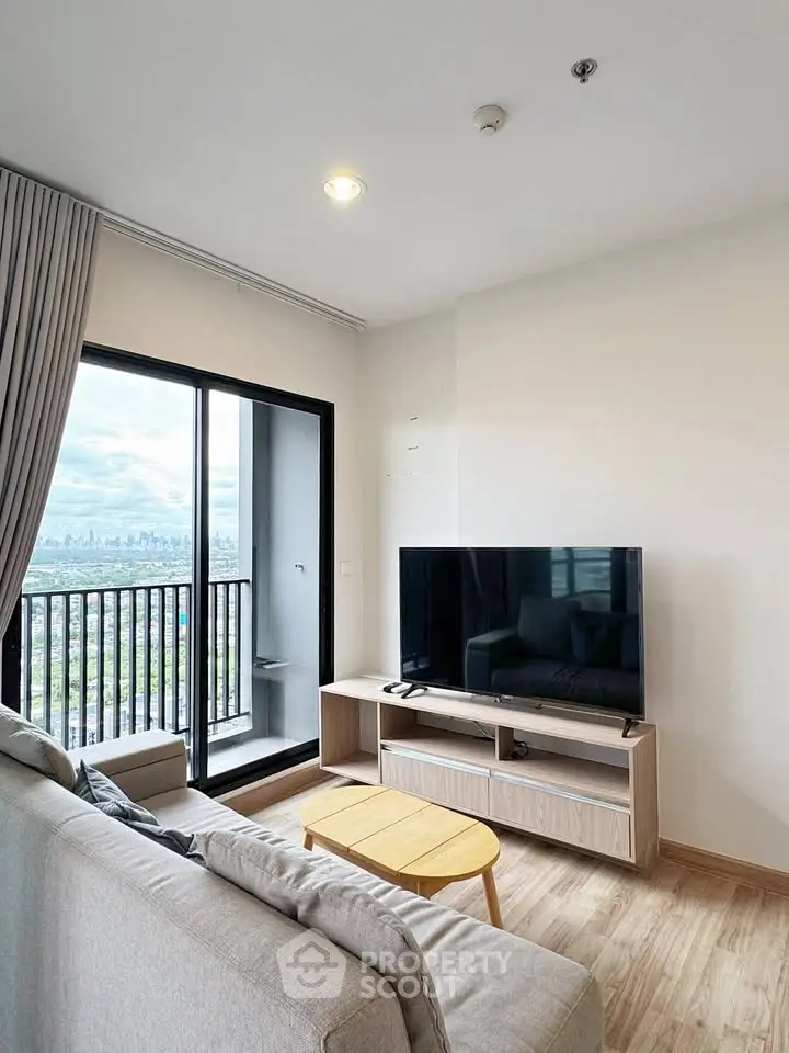 Modern living room with balcony view in high-rise apartment