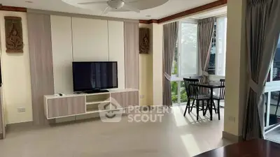 Spacious living room with modern decor and natural light