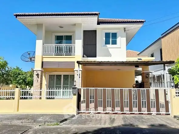 Charming two-story house with modern design and spacious balcony in a serene neighborhood.