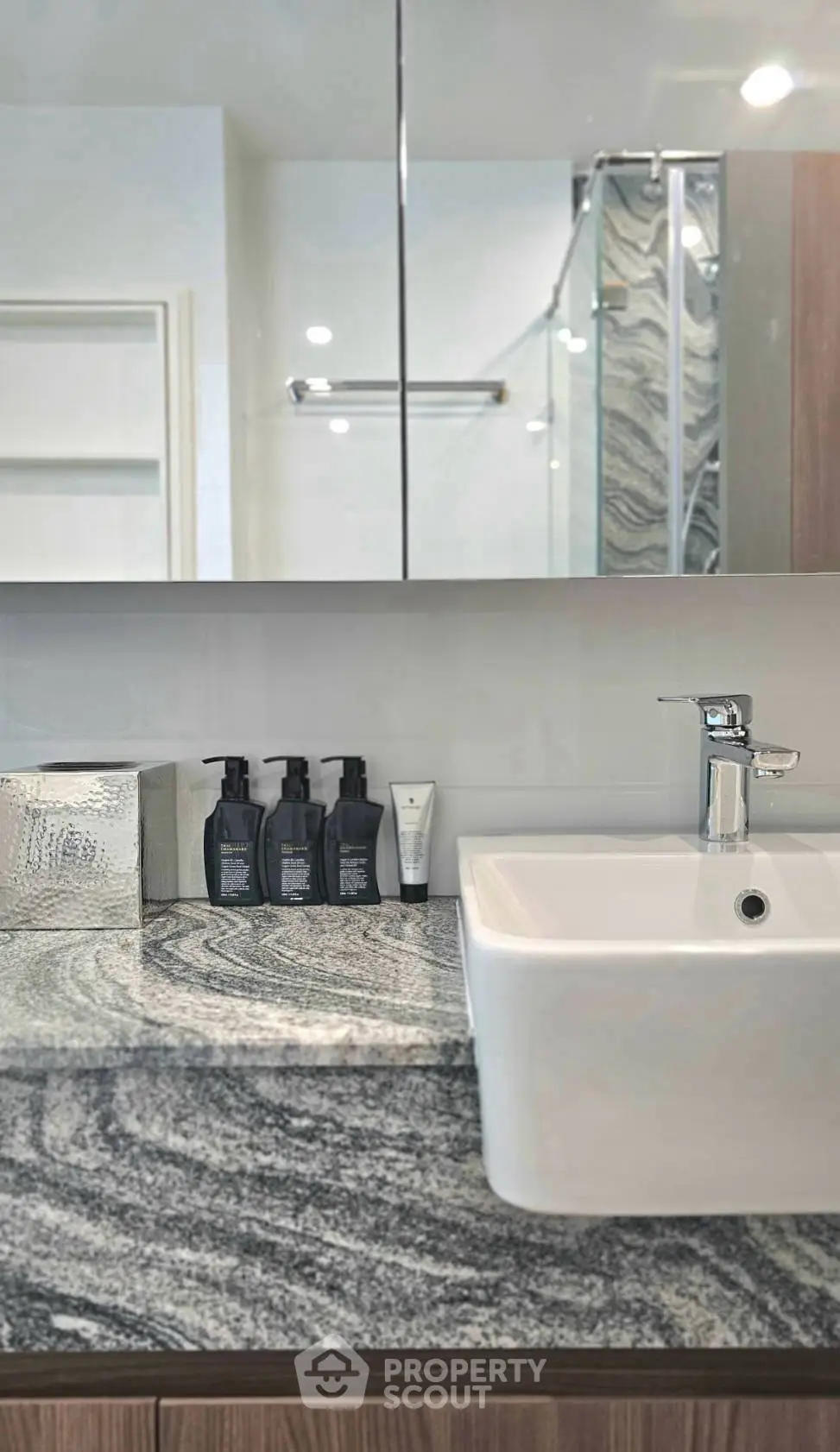 Modern bathroom with sleek sink and elegant marble countertop