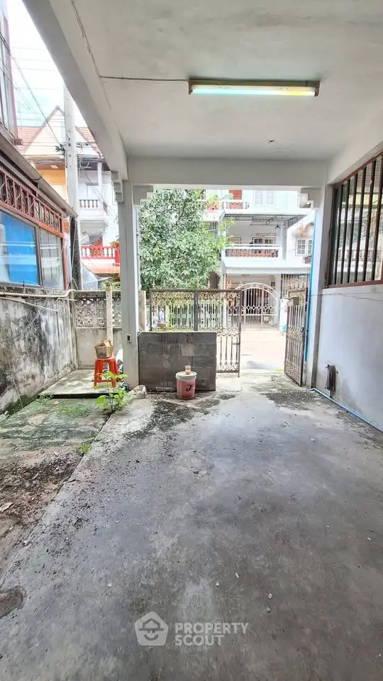 Spacious garage area with open view to residential street, ideal for parking or storage.