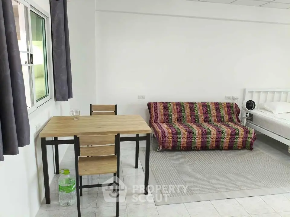Cozy studio apartment with modern furniture and natural light