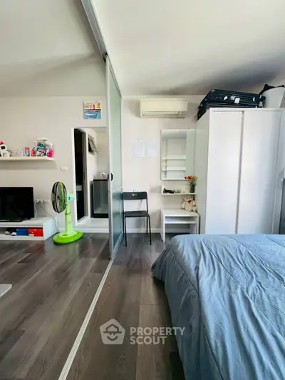 Modern bedroom with sleek design and ample storage space