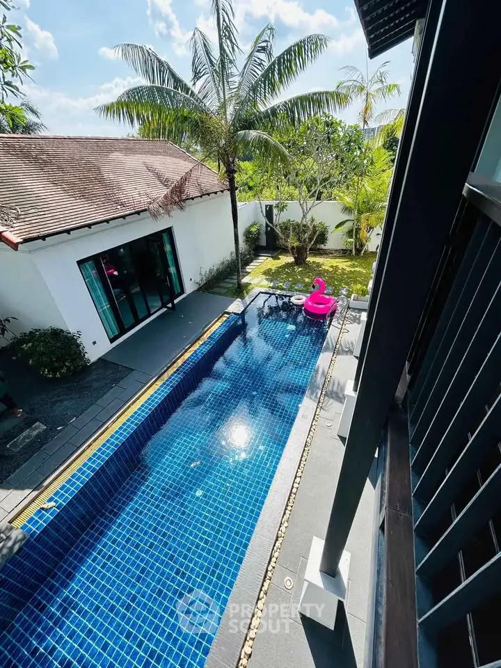 Stunning villa with private pool and lush garden view, perfect for tropical living.
