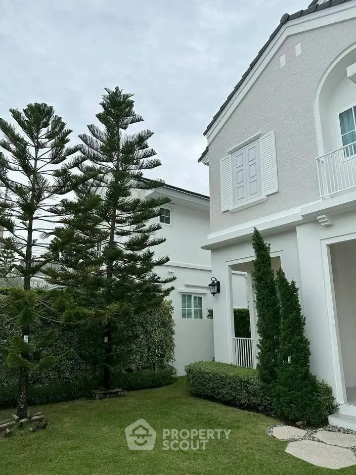 Charming suburban home with lush garden and elegant exterior design, perfect for family living.