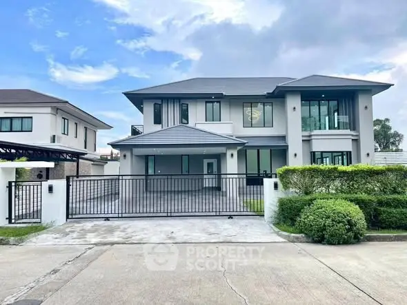 Stunning modern two-story house with sleek design and spacious driveway