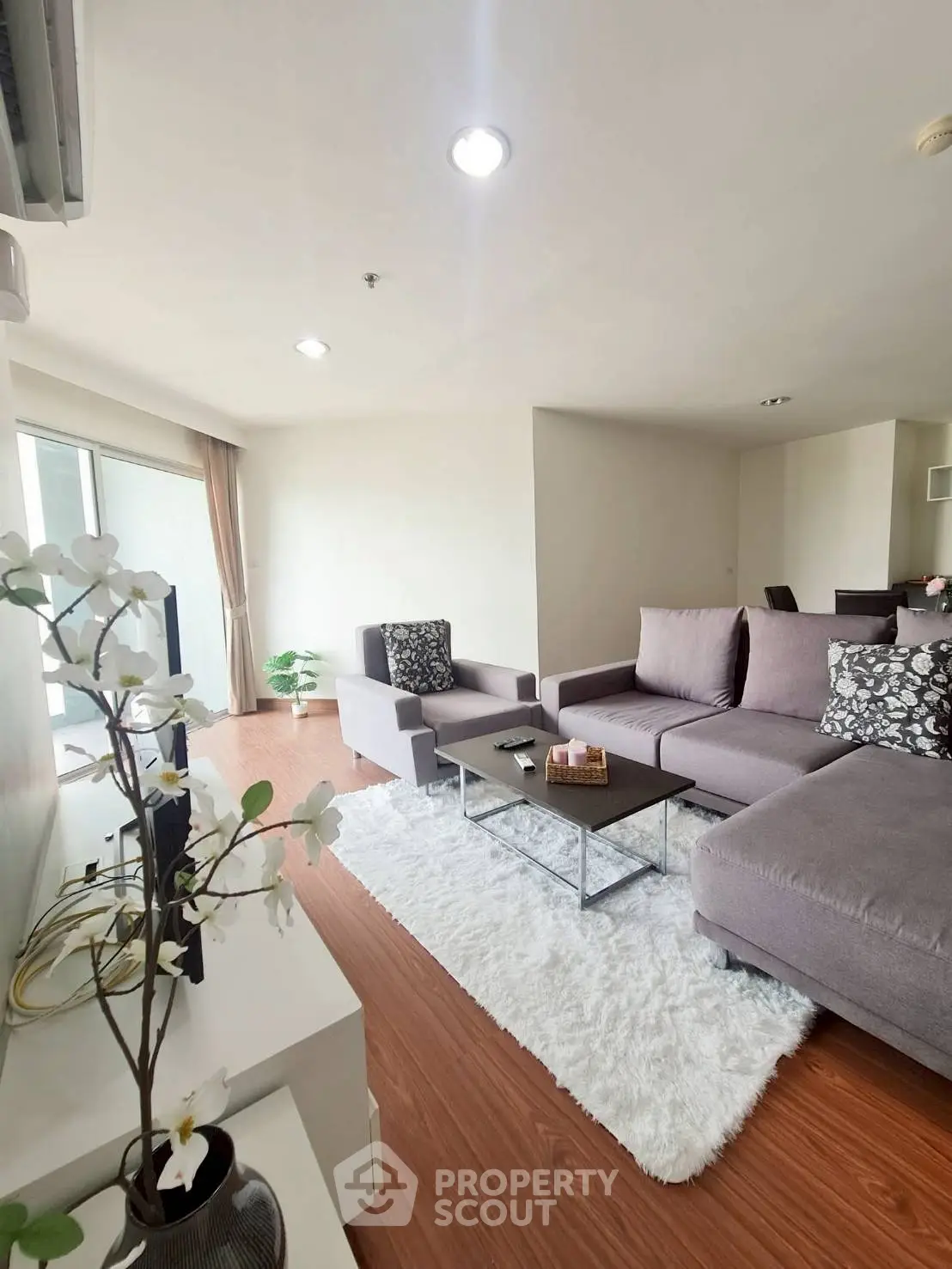 Spacious modern living room with cozy seating and elegant decor