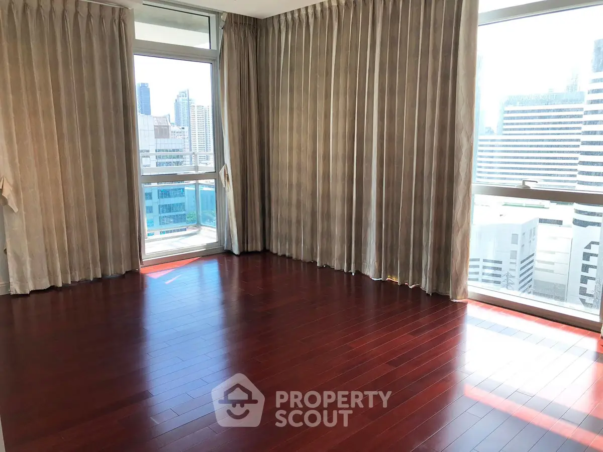Spacious corner unit with stunning city view and elegant hardwood floors.