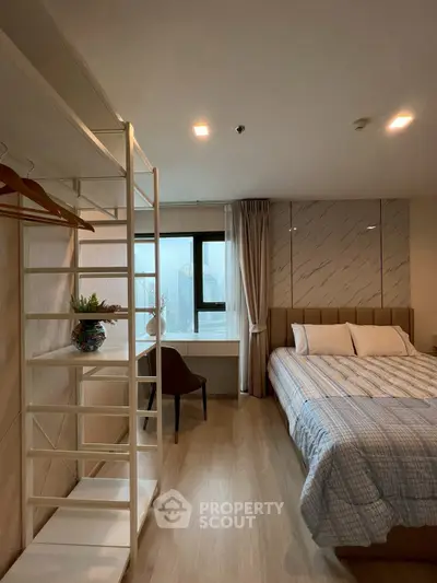 Modern bedroom with stylish decor and natural light