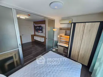 Modern bedroom with sliding doors and stylish wooden furniture