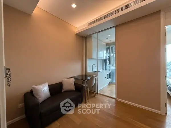 Modern compact living room with sleek kitchen and cozy sofa