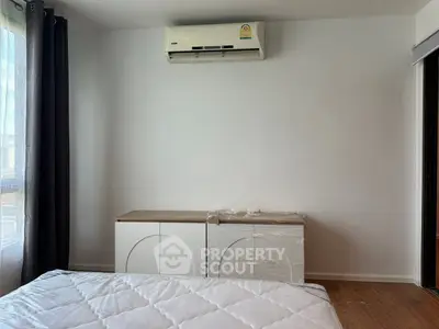 Cozy bedroom with air conditioning and natural light