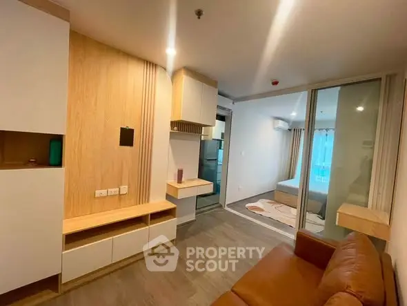 Modern apartment interior with cozy living room and bedroom view