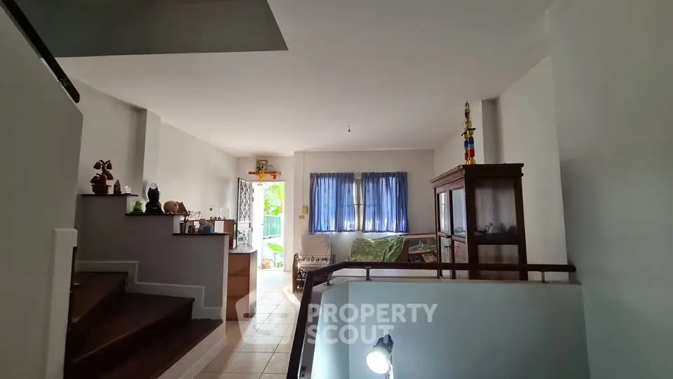 Spacious living area with natural light and modern decor