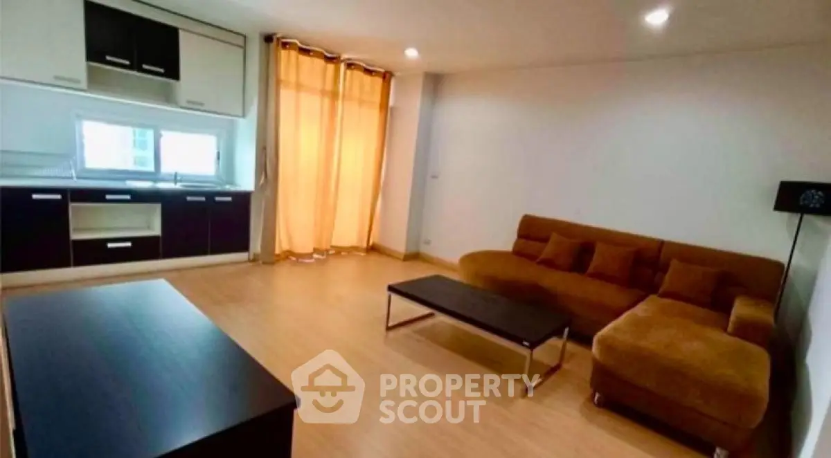 Spacious modern living room with open kitchen and cozy sofa