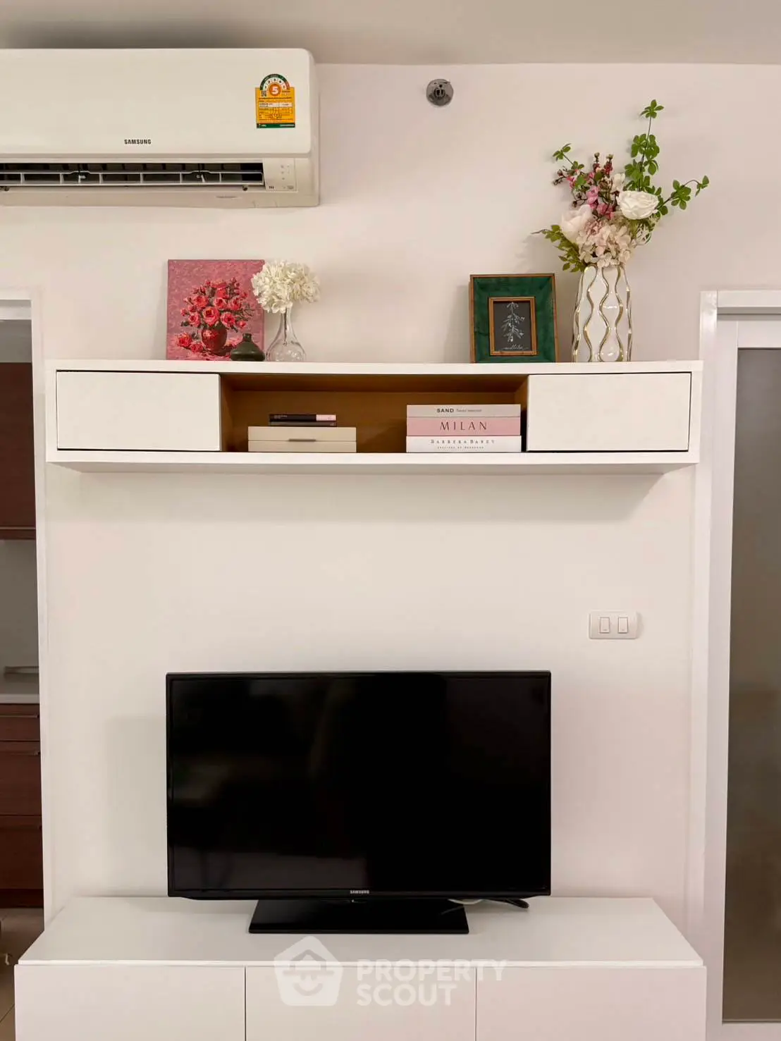 Modern living room with sleek TV setup and stylish decor