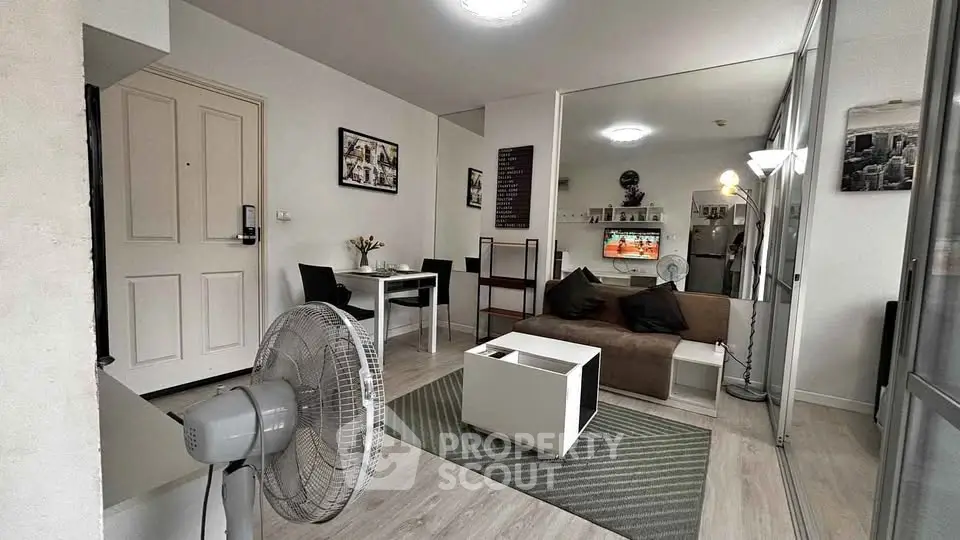 Modern living room with stylish decor and cozy seating area, perfect for relaxation and entertainment.