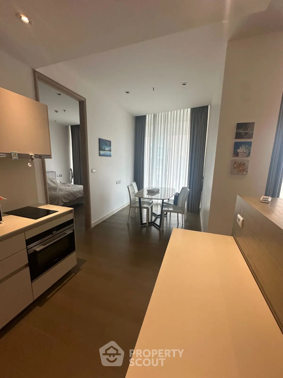 Modern open-plan kitchen and dining area with sleek design and natural light.