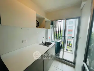 Modern kitchen with balcony view in a stylish apartment