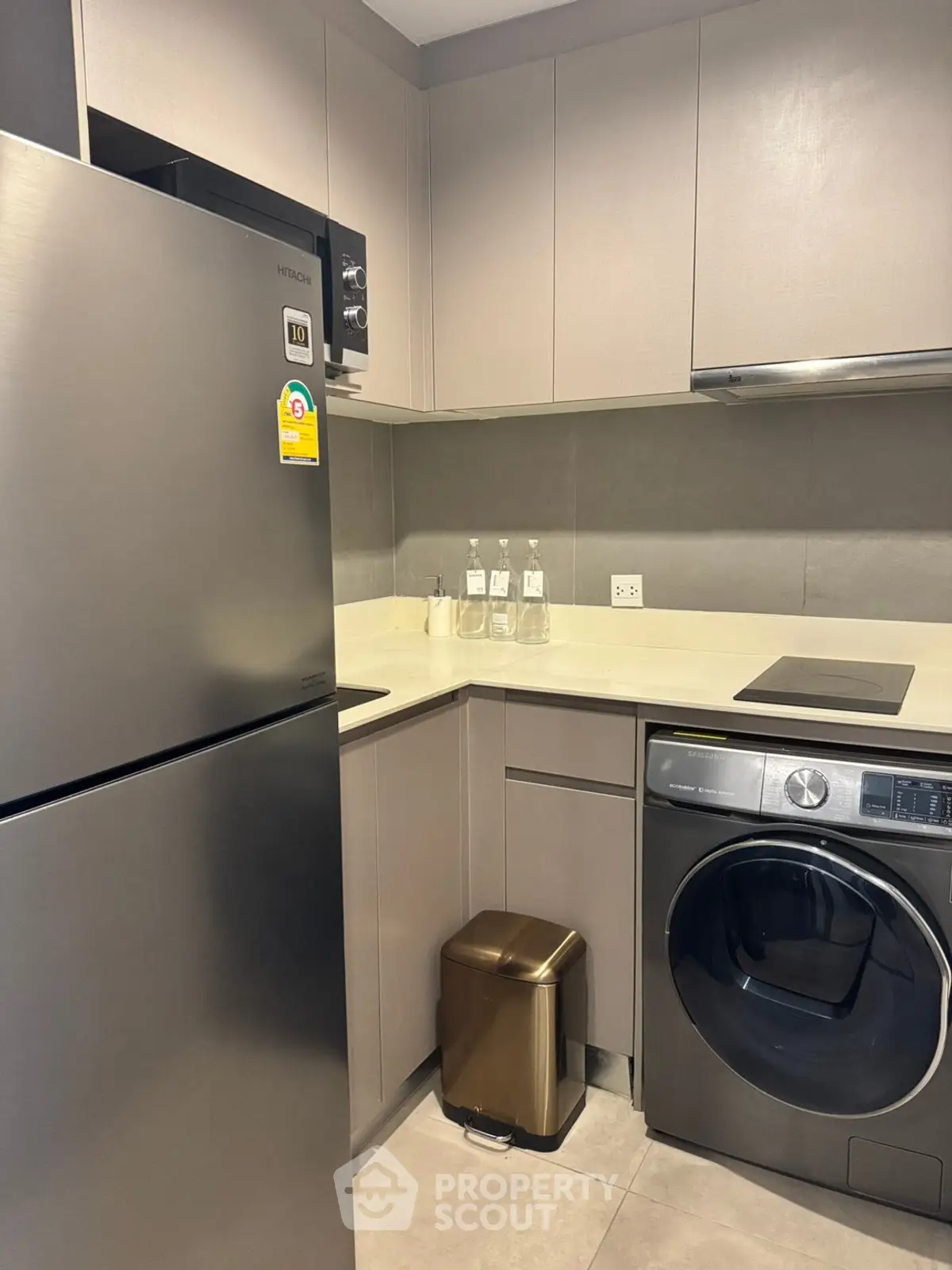 Modern kitchen with sleek appliances and compact design