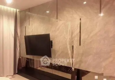Modern living room with sleek TV setup and elegant decor