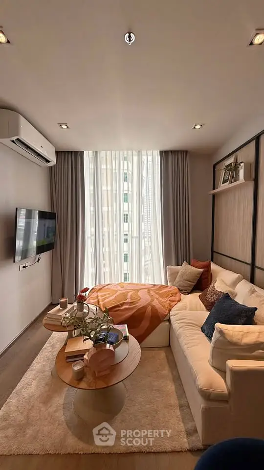 Cozy living room with modern decor and large window view