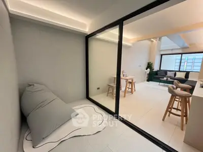 Modern open-layout living room with stylish decor and cozy seating area