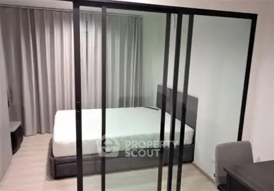 Modern bedroom with glass partition and minimalist design