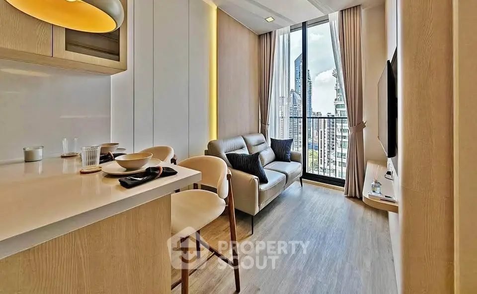 Modern living room with city view, stylish decor, and open layout in high-rise apartment.