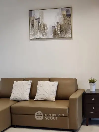 Modern living room with stylish sofa and cityscape artwork, perfect for urban living.
