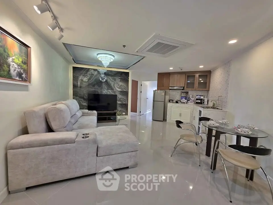 Modern living room with open kitchen and stylish decor