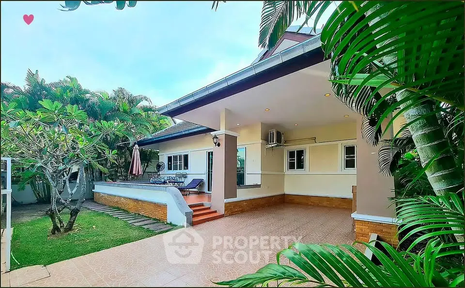 Charming single-story home with lush garden and spacious patio, perfect for outdoor relaxation.