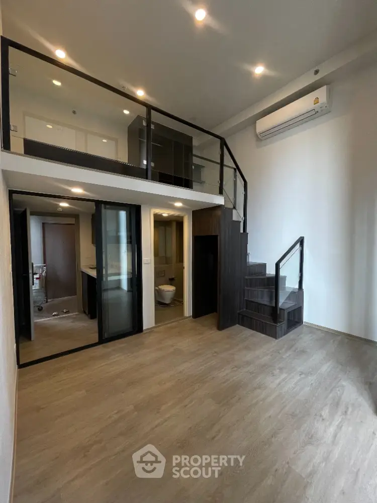 Modern loft apartment with mezzanine and sleek interior design