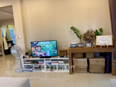 Cozy living room with modern decor and entertainment center