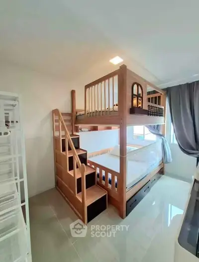 Modern bedroom with stylish wooden bunk bed and natural light