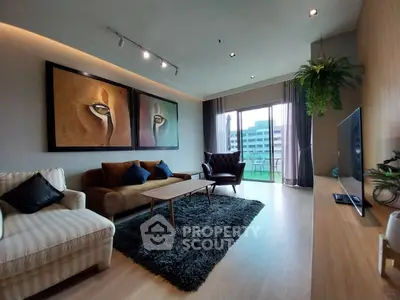 Spacious living room with modern decor and large balcony view
