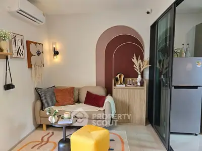 Chic modern living room with stylish decor and cozy seating area.
