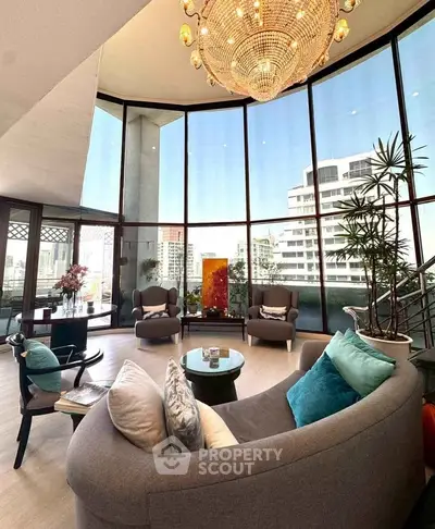 Luxurious living room with panoramic city views and elegant chandelier