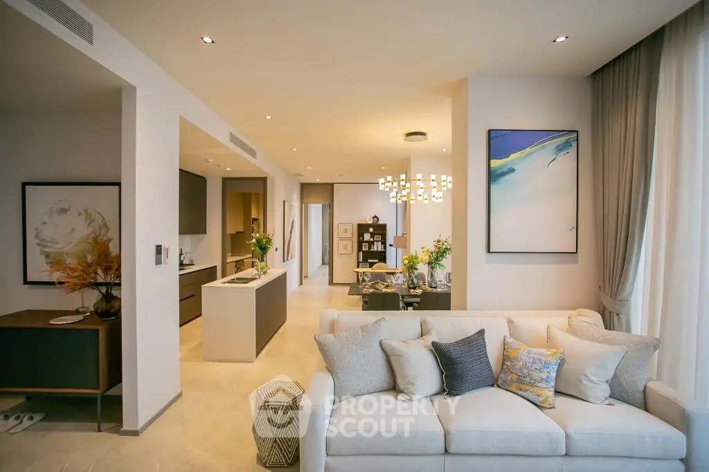 Luxurious open-plan living room with modern decor and elegant lighting in a high-end apartment.
