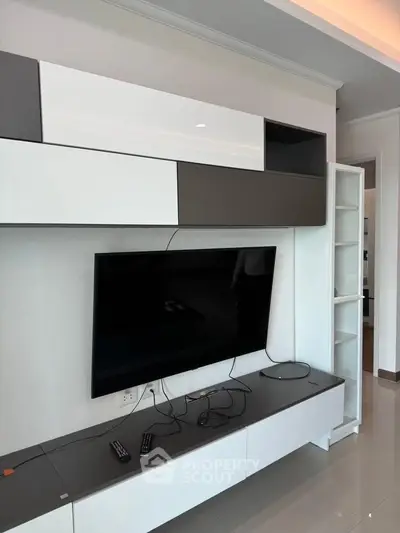Modern living room with sleek TV unit and stylish storage cabinets
