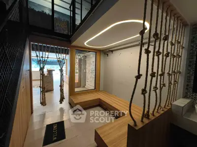 Modern interior with unique rope design and wooden seating area, perfect for creative spaces.