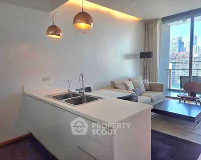 Modern open-layout kitchen and living room with city view in luxury apartment