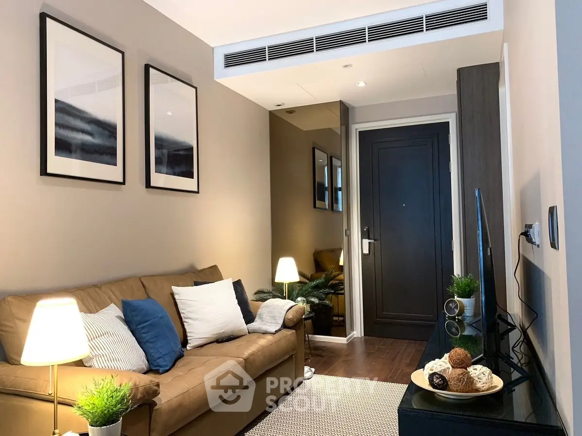 Cozy living room with modern decor and comfortable seating in a stylish apartment.