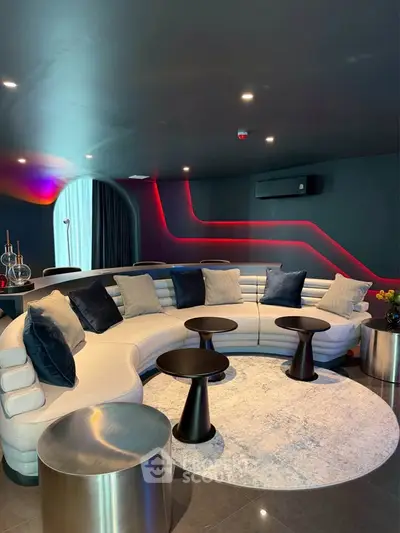 Luxurious modern living room with curved sofa and ambient lighting