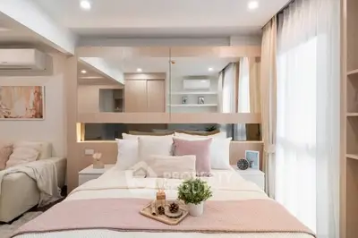 Luxurious bedroom with elegant decor and ample natural light