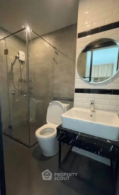 Modern bathroom with glass shower and sleek fixtures