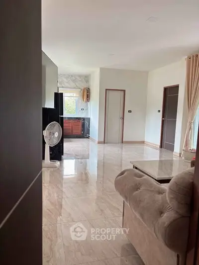 Spacious living room with marble flooring and elegant decor